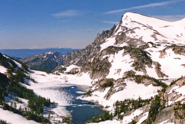 Snow-covered Enchantment Lakes basin in early July, seen from near Prusik Pass