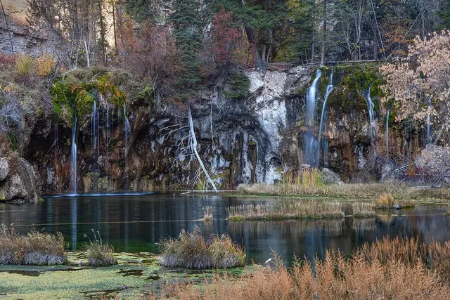 Hanging Lake in mid October with fall color above the travertine falls