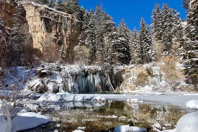 Hanging Lake on New Year's Eve, frozen at the edges under fresh snow