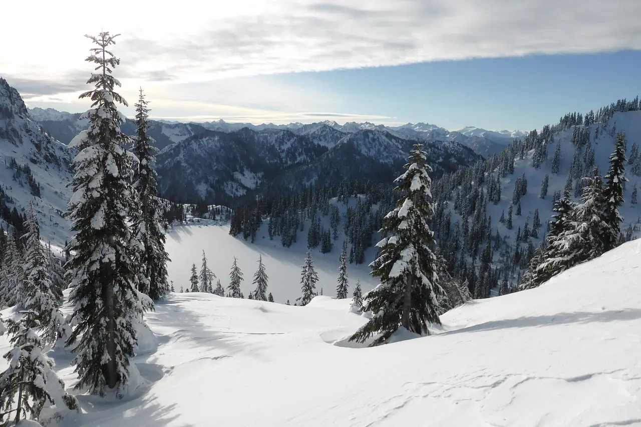 Lake Valhalla buried in December snow, seen from the slope of Mount McCausland