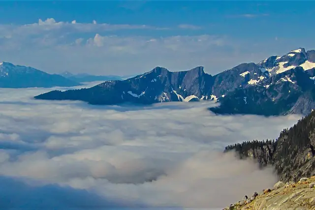 Trappers Peak and Mt. Triumph above a sea of cloud in August