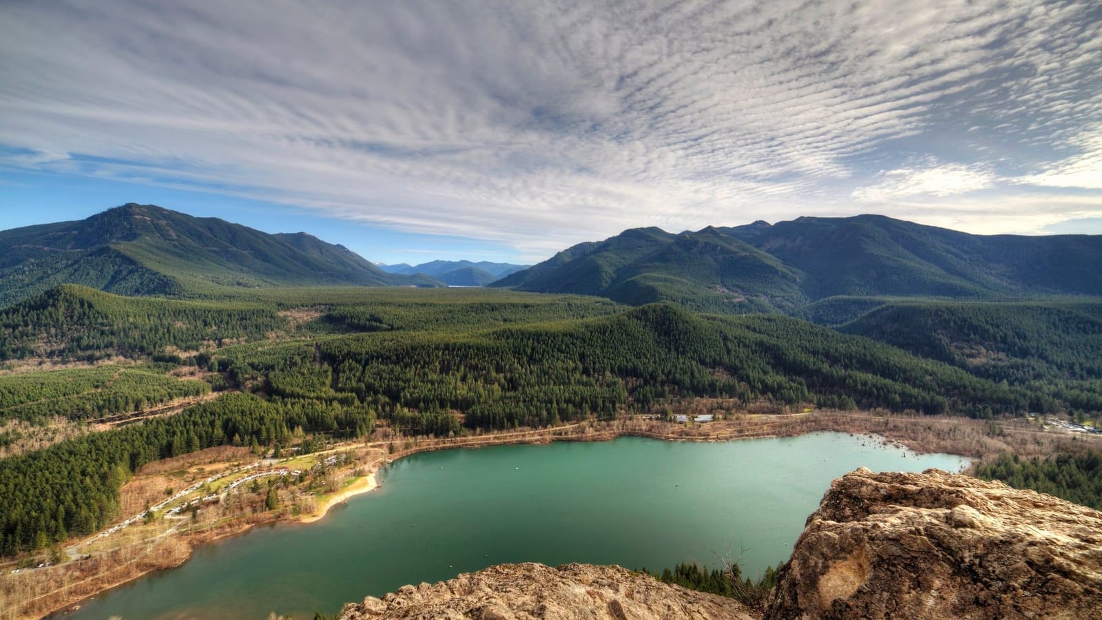 Rattlesnake Lake and the Cedar River valley seen from the rock outcrop of Rattlesnake Ledge under rippled clouds
