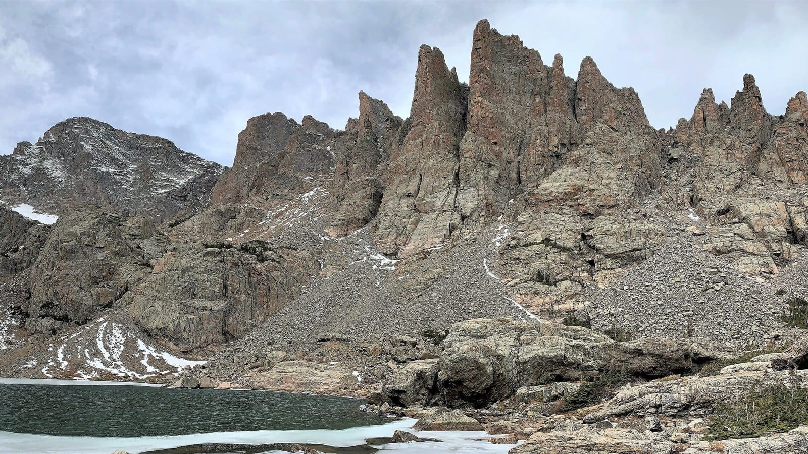 The jagged Cathedral Spires rising over Sky Pond in Rocky Mountain National Park