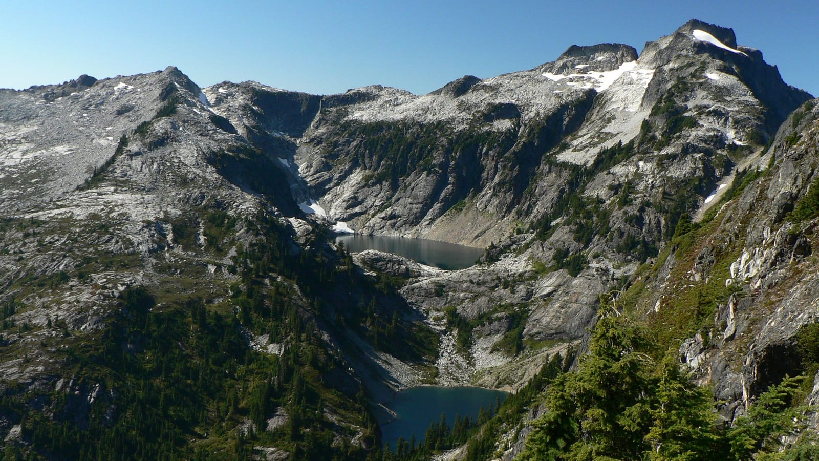 Two of the Thornton Lakes stacked in a granite cirque below Mt. Triumph, seen from the Trappers Peak ridge